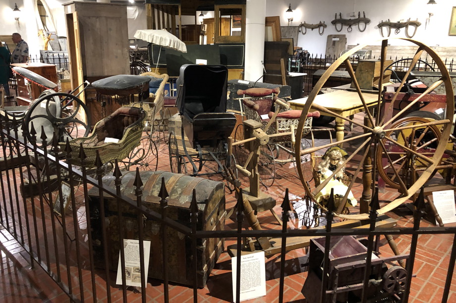 Baby carriages, chairs, chests, spinning wheels, tables—all old