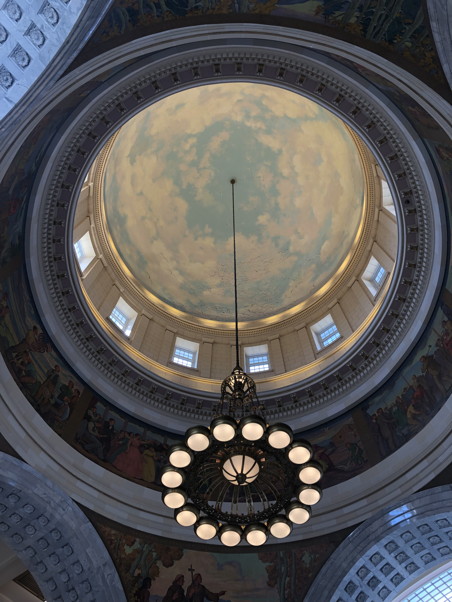 Looking up to the interior of the capitol dome, which was painted light blue with clouds