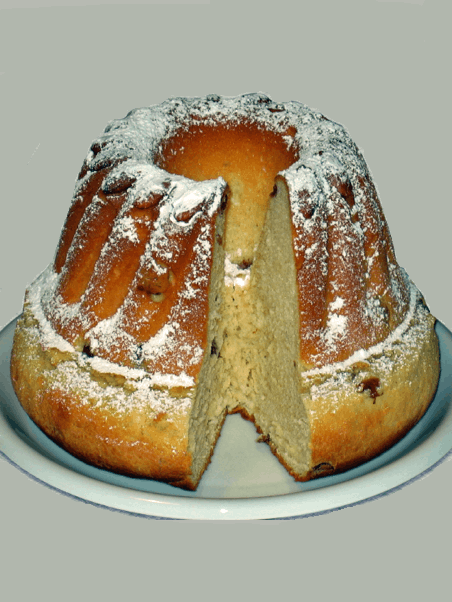 A delicious baked good with powdered sugar, it looks like a bundt cake
