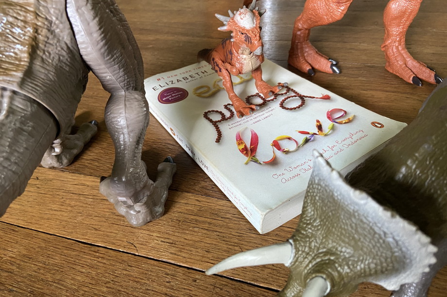 Book with dinosaurs crawling on it