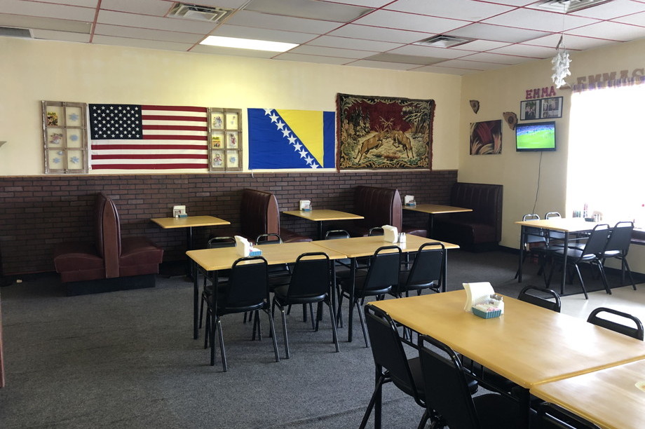 Interior of restaurant with flags of the United States and Bosnia and Herzegovina