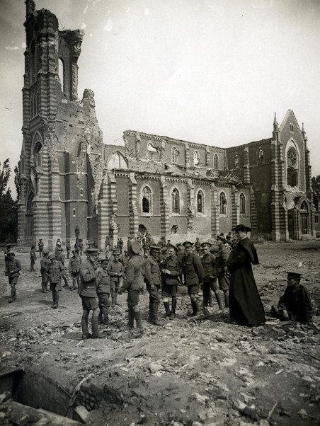 Black and white photo of church bombed and soldiers walking around