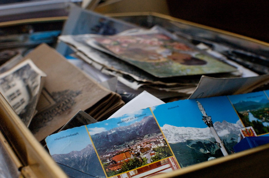 Old postcards in a box, facing the opposite direction as the signup page