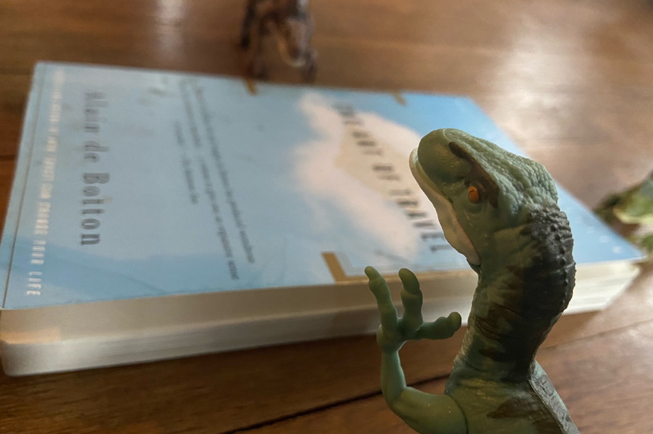 A book surrounded by dinosaurs