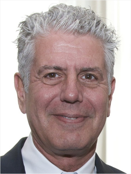 Man with white hair, smiling