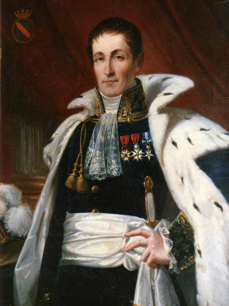 Man in a cape, with a sash and a few medals